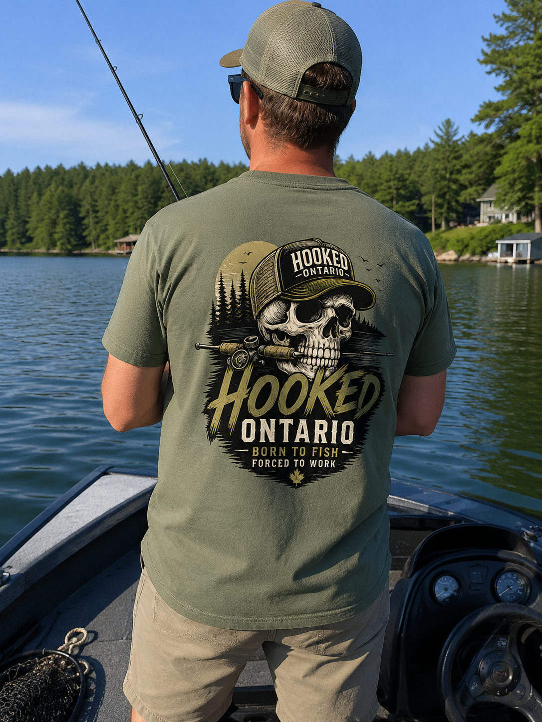 Angler in a green Hooked Ontario 'Born To Fish' skull tee casting from a boat